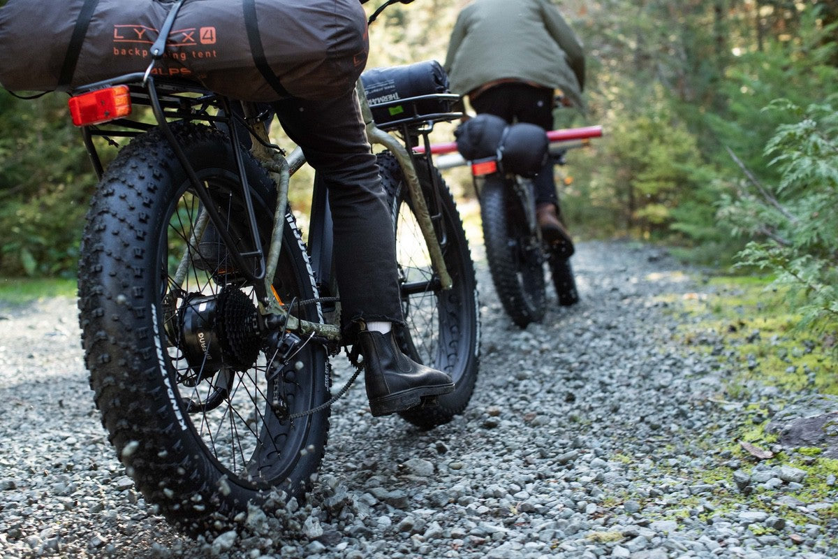 Fat-tire eBike tires riding down gravel path in chilly weather