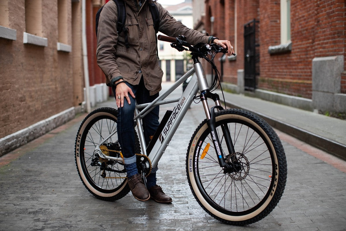 A person sitting on a Surface604 eBike