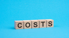 building blocks with costs written on with blue background