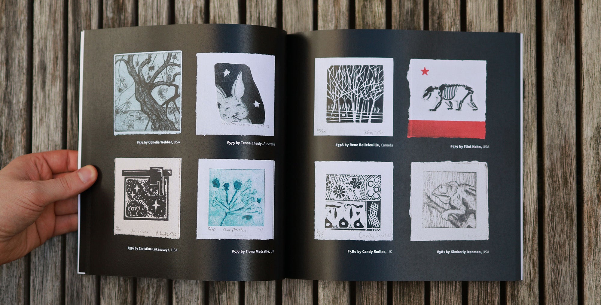 A photo of the catalogue. 4 tiny prints are shown on each page in their original size