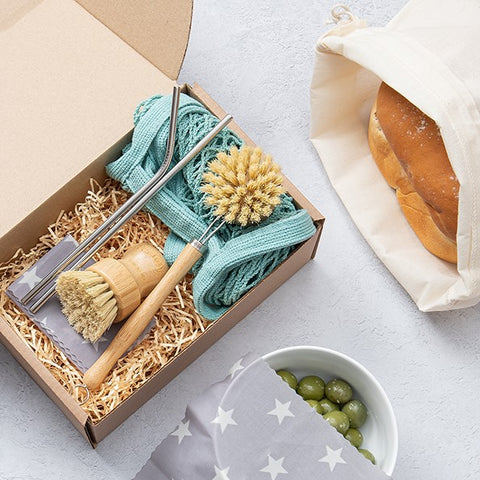 zero waste gift set including wooden brushes, cotton bread bags and wax wraps