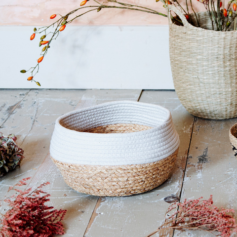 Natural sea grass storage basket in a natural and white contrasting colour block style.