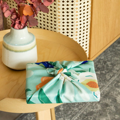 book wrapped in a furoshiki cloth on a table