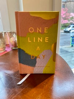 One Line a Day: 5 Year Memory Book. Image of book cover which is colorful paint brush strokes of pink, blue, and green and gold lettering.