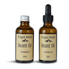 two dark brown glass bottles. One with a screw top lid and one with a pipette lid. Label text reads Rugged Nature, Beard Oil, Sandalwood, 50ml