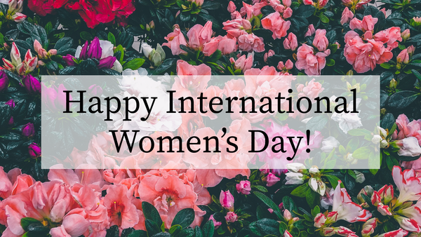 "Happy International Women's Day" with flowers behind the text