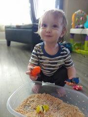 baby boss playing with his new sensory bin, toddler fun ideas, bundle of joy box