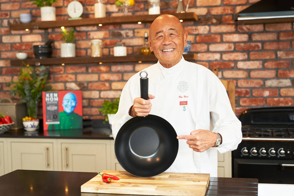 Ken Hom Pointing At A Wok