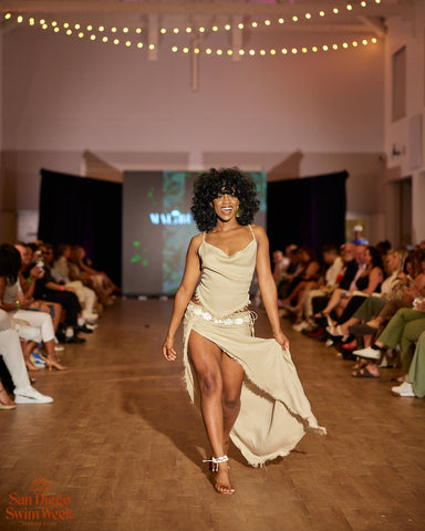Black woman wearing flown tan skirt set