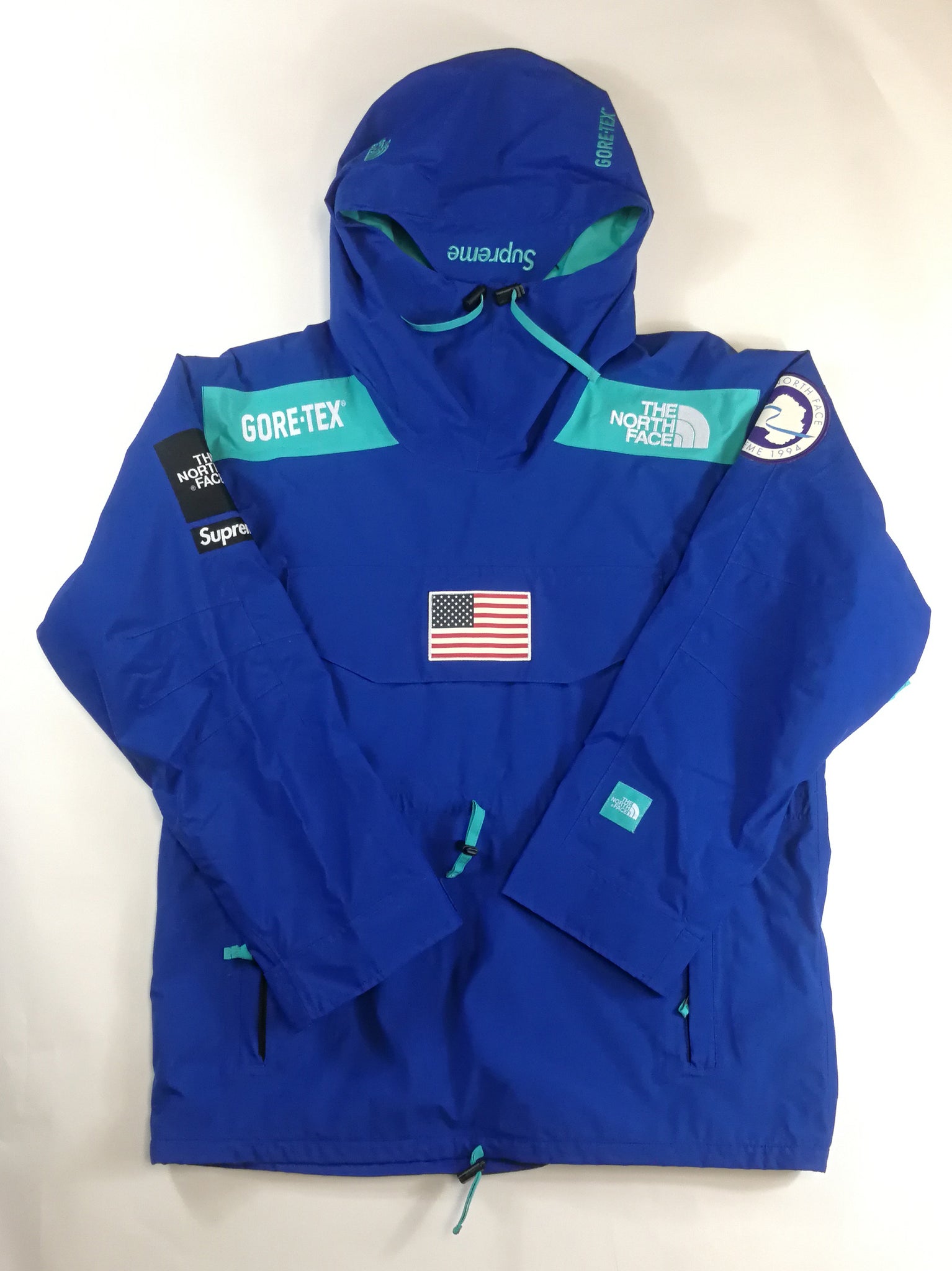 blue north face supreme jacket