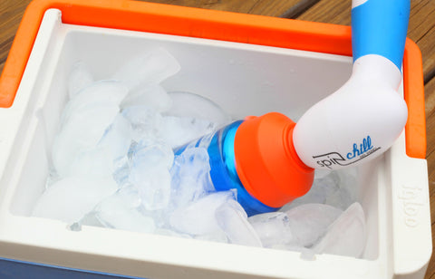 Orange and blue SpinChill spinning beer in small cooler of ice.