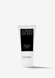 Mandelic Exfoliating Mask product image. White tube with black JSS label standing up against a stark white background. Dramatic shadow extends diagonally from base of tube into the foreground.