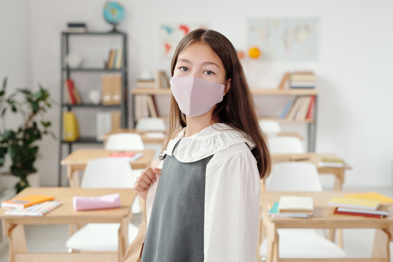 school girl wearing flushields face mask