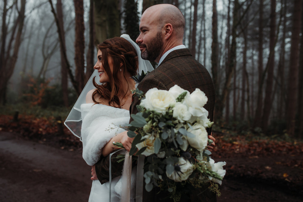 bride with groom wears faux fur stole cover up