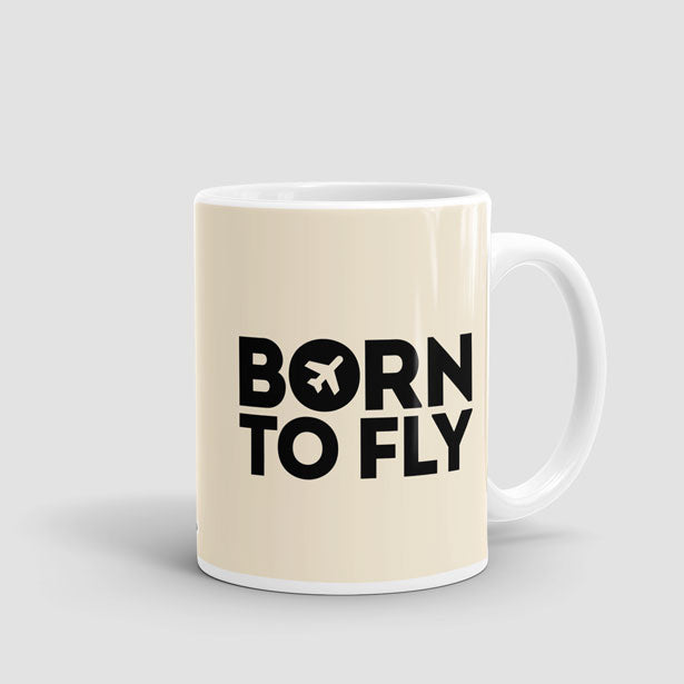 https://cdn.shopify.com/s/files/1/0322/6285/products/BORN-TO-FLY-BEIGE-11oz-mug.jpg?v=1556136640&width=615