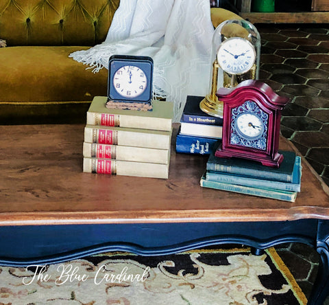 Small clocks & antique books as retail displays