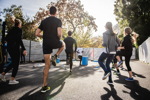 Group of people exercising outside