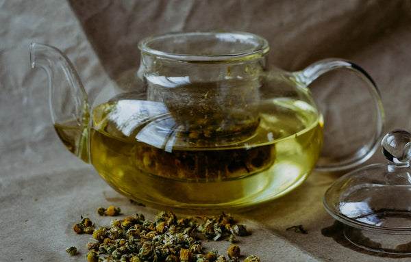 Glass teapot as chamomile tea