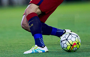 Male Soccer Player Navigating Ball
