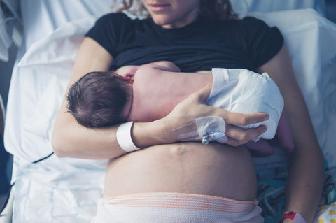 New mother breastfeeding her newborn