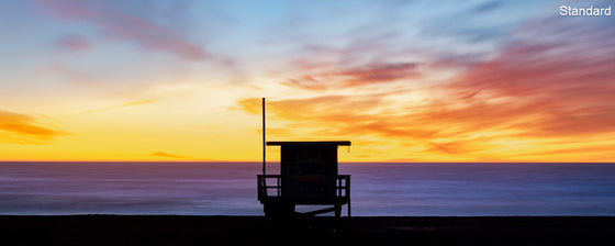 A panoramic photo of a lifeguard tower in Hermosa Beach / Manhattan Beach (Los Angeles California) at sunset.