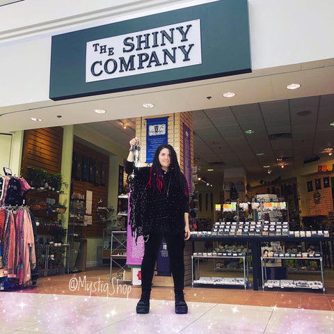 Marina in front of The Shiny Company, at Whote Oaks Mall, holding Mystiq jewelry