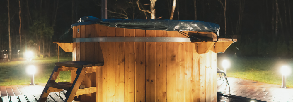 A hot tub outside in the garden 