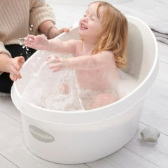 Girl Splashing in Shnuggle Toddler Bath