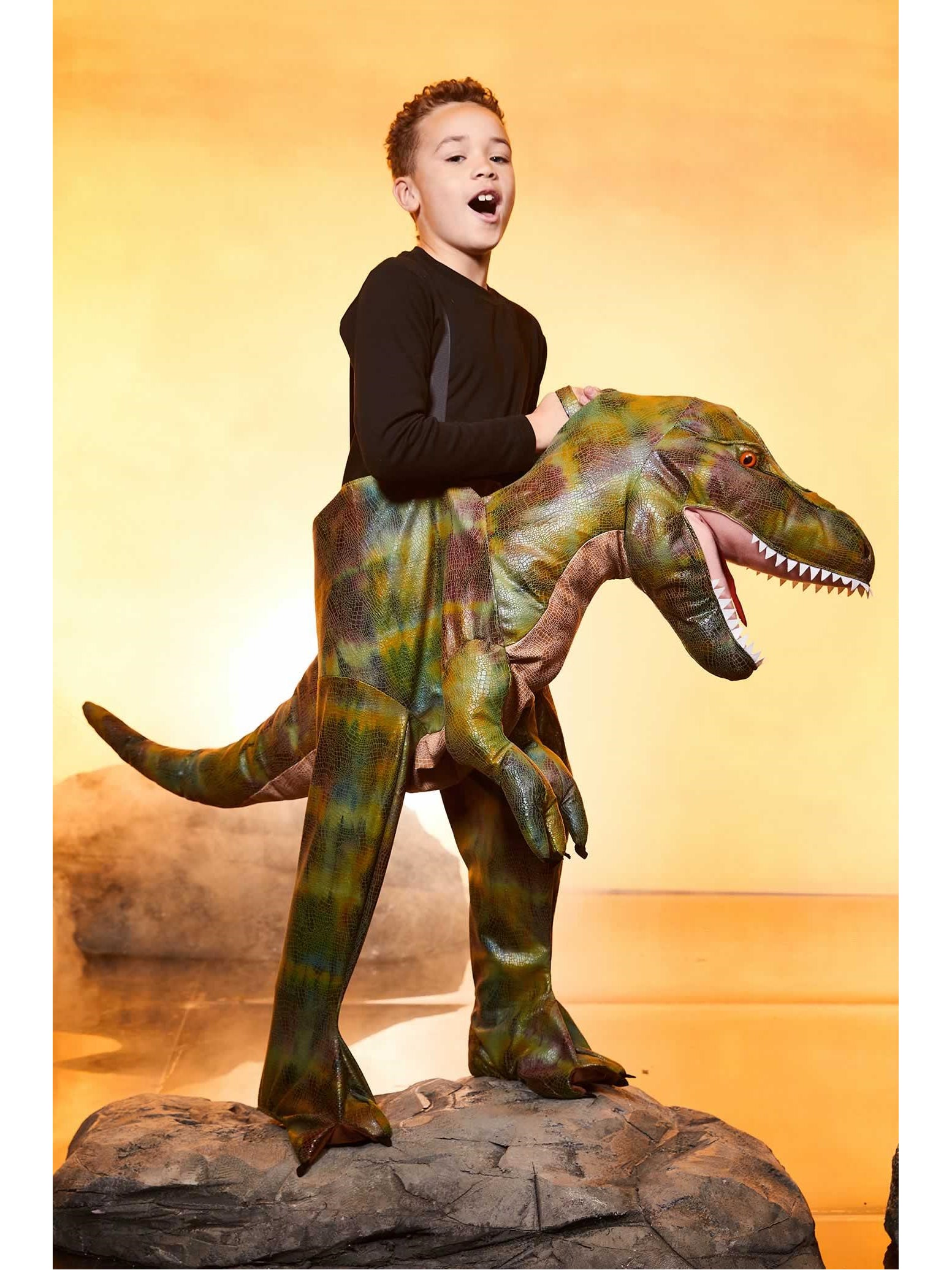 kid riding a dinosaur costume