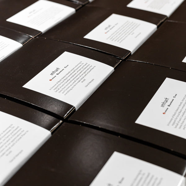 black gift boxes with message from Intuit Canada country manager, David Marquis