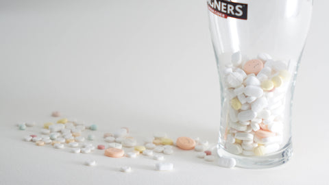 A beer mug filled with pills 