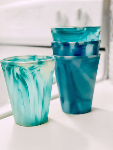 Four Ocean-Inspired Silicone Cups sitting on a white table