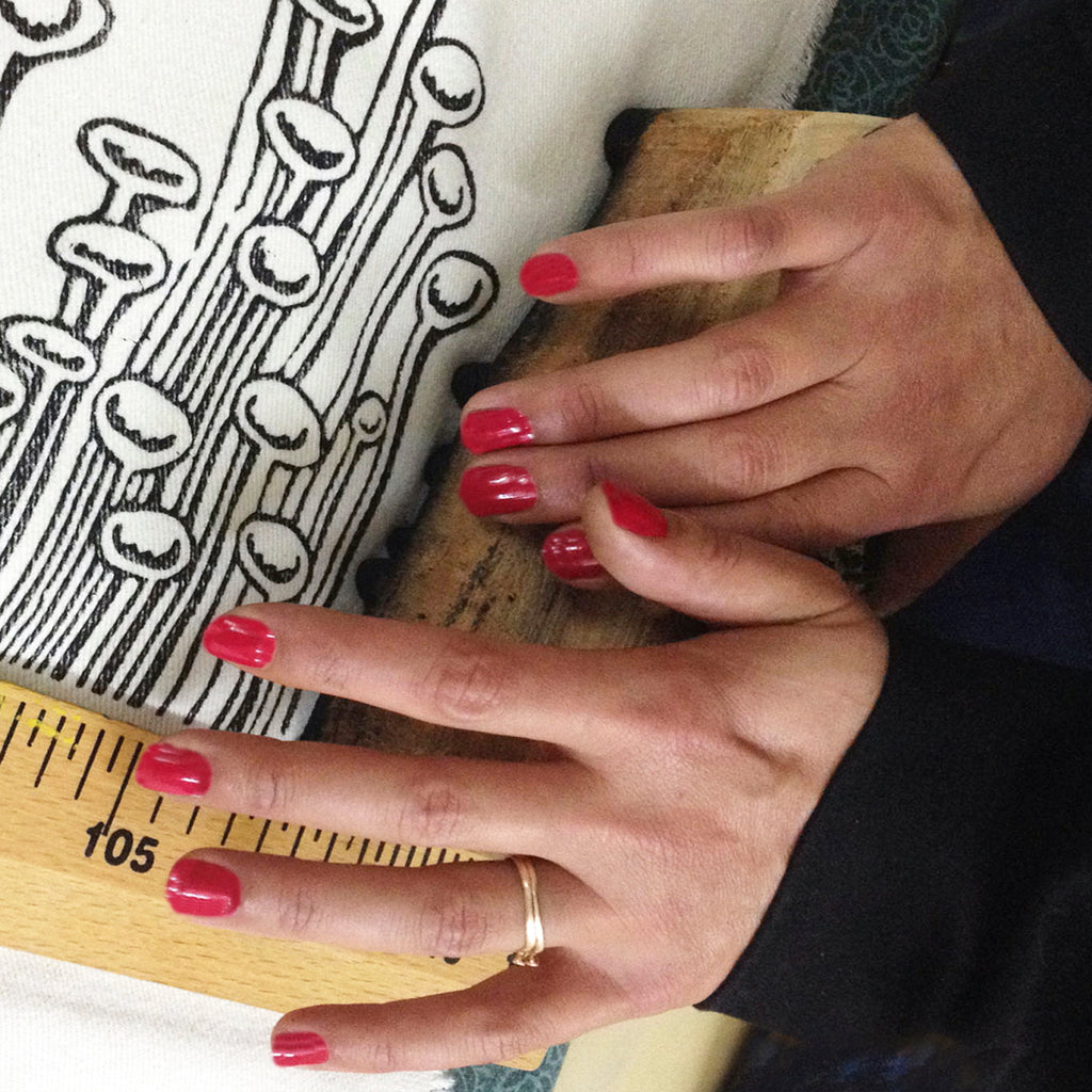 Our artisan woodblock printing the illustration on to our fabrics in their atelier.