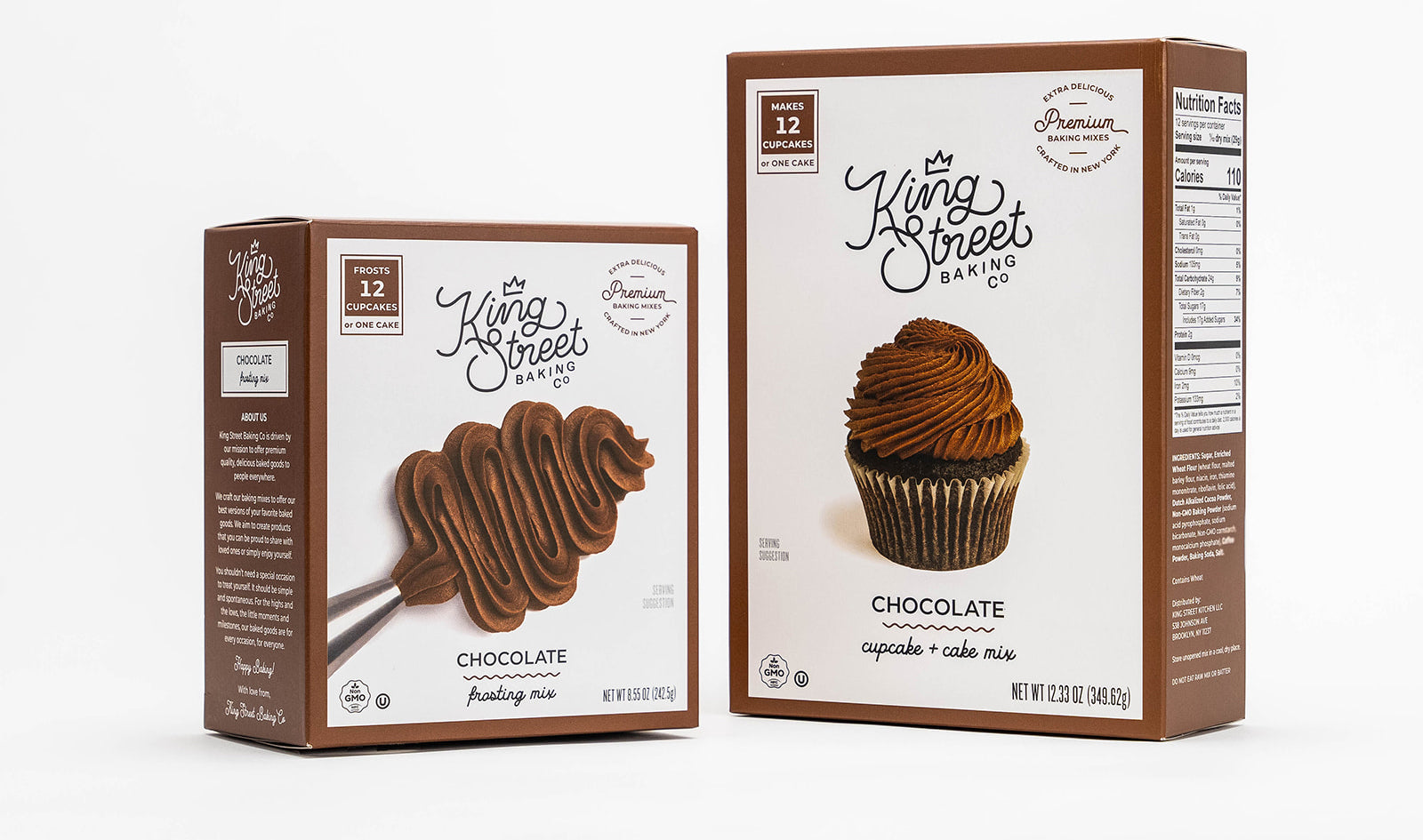 One box of King Street Baking Co.'s Chocolate Frosting Mix (left) next to one box of Chocolate Cupcake and Cake Mix.