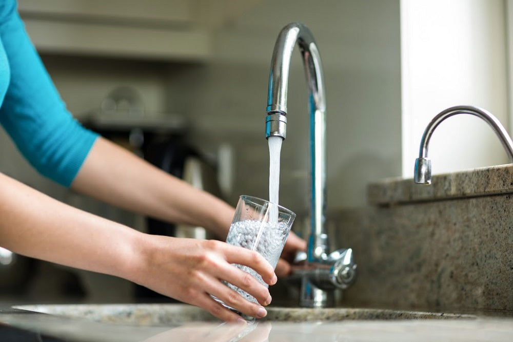 drinking sink water in bathroom