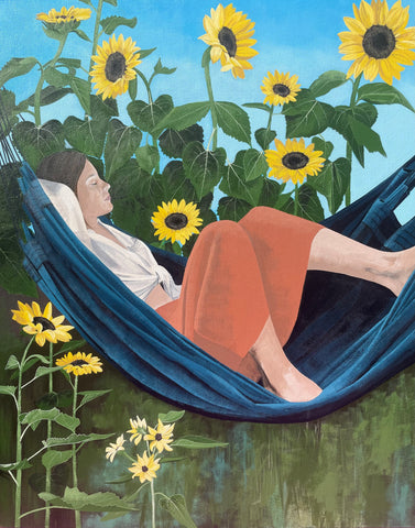 Woman resting in hammock in sunflower garden