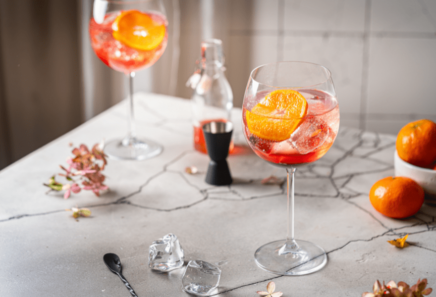 Two glasses of non-alcoholic Aperitif Spritz made with Sans Bar Notting Hill Stroll and Sans Bar Spritzing in Venice