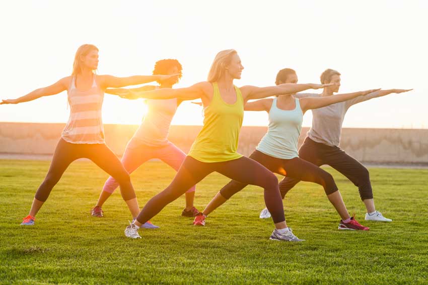 Women exercising together outdoors