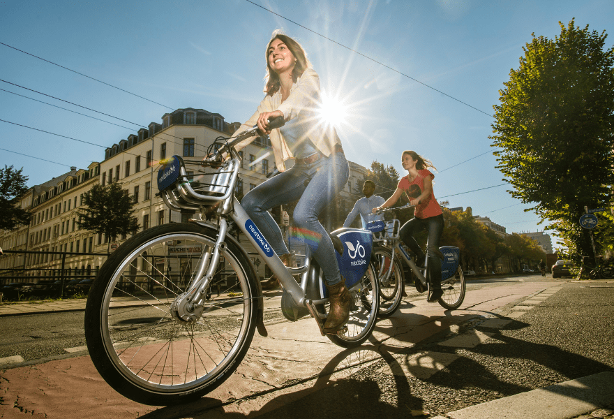 A happy woman riding a bike