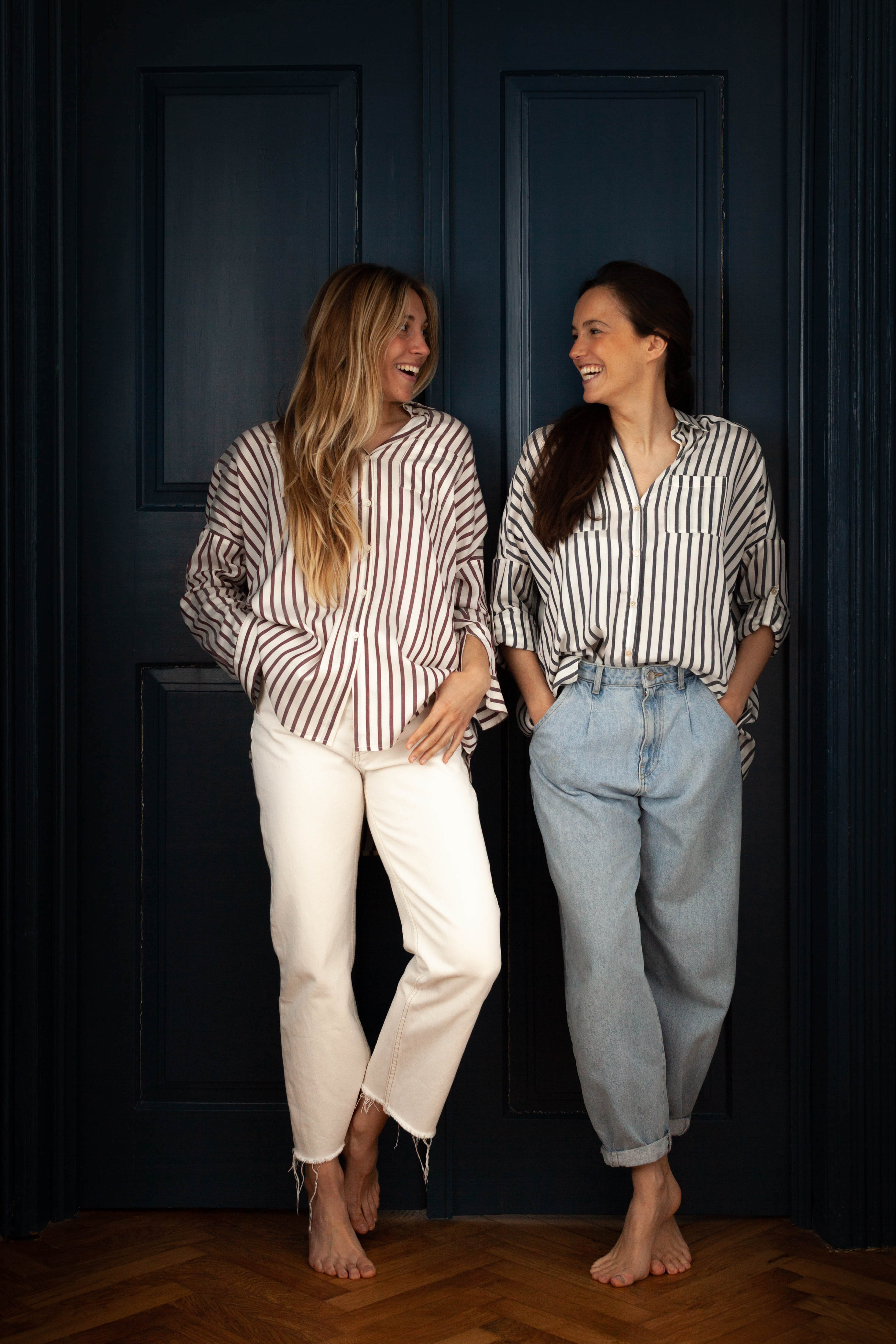 Two ladies wearing a striped shirt