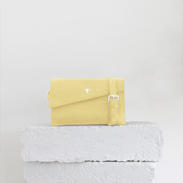 pastel yellow clutch bag