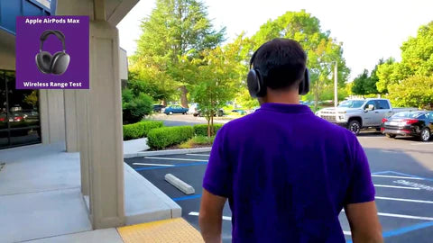 man with headset on walking into a parking lot  outside of an office