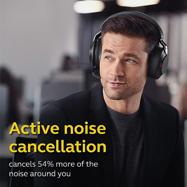 man wearing a jabra evolve2 85 headset in office. wording beneath talking about noise reduction