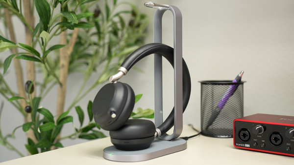 Yealink BH76 wireless headset resting on the Qi wireless charge stand