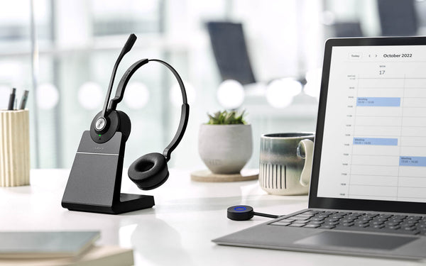 jabra engage 55 duo headset on stand on an office desktop