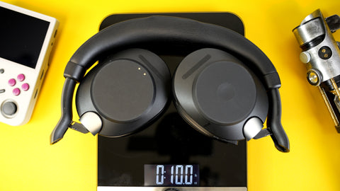 Jabra Evolve 2 85 Bluetooth headset resting on a scale with 10 ounces showing on the display