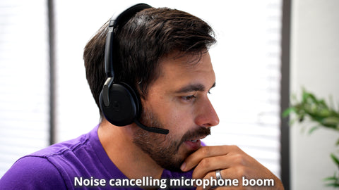 man wearing a Jabra Evolve2 65 Flex bluetooth headset showing the microphone boom arm