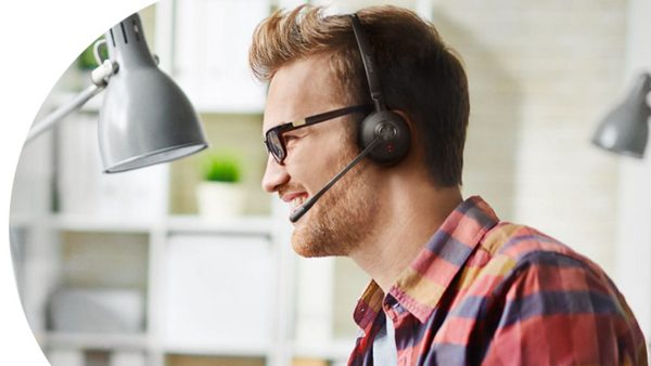 man sitting at desk wearing a Jabra Engage 75 mono headset