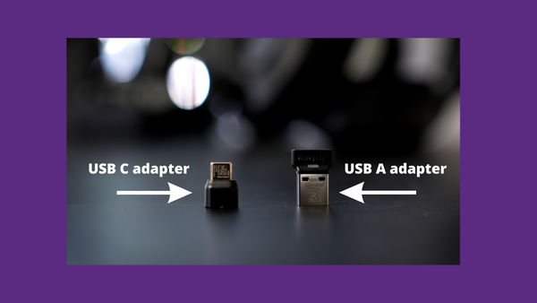 Jabra USB A, and USB C adapters on desktop with labeling