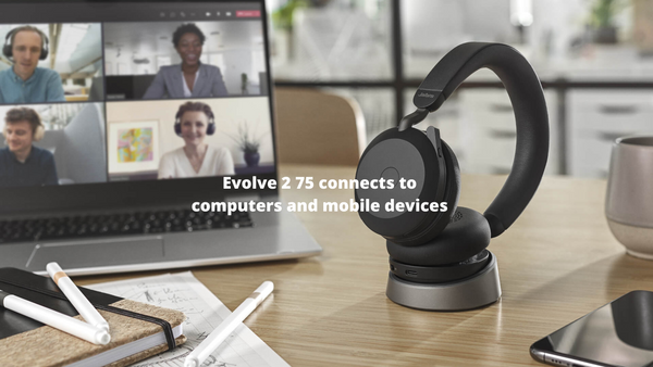 A Jabra Evolve2 75 sitting on a desktop next to a computer and mobile phone